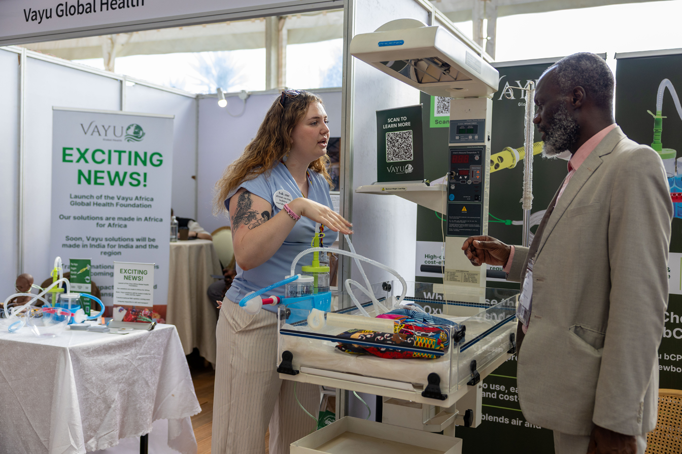 An attendee discusses a product at a booth in the exhibit hall at the International Maternal and Newborn Health Conference 2026