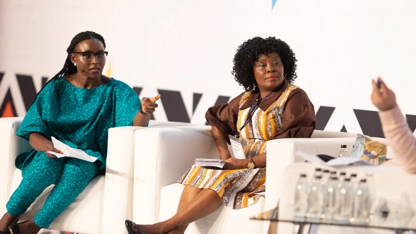 Mercy Juma interviews panellist at the International Maternal and Newborn Health Conference 2023