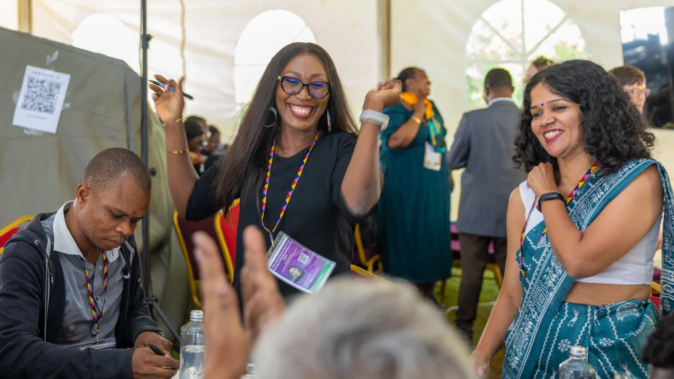 Attendees at the International Maternal and Newborn Health Conference in 2026 celebrate together