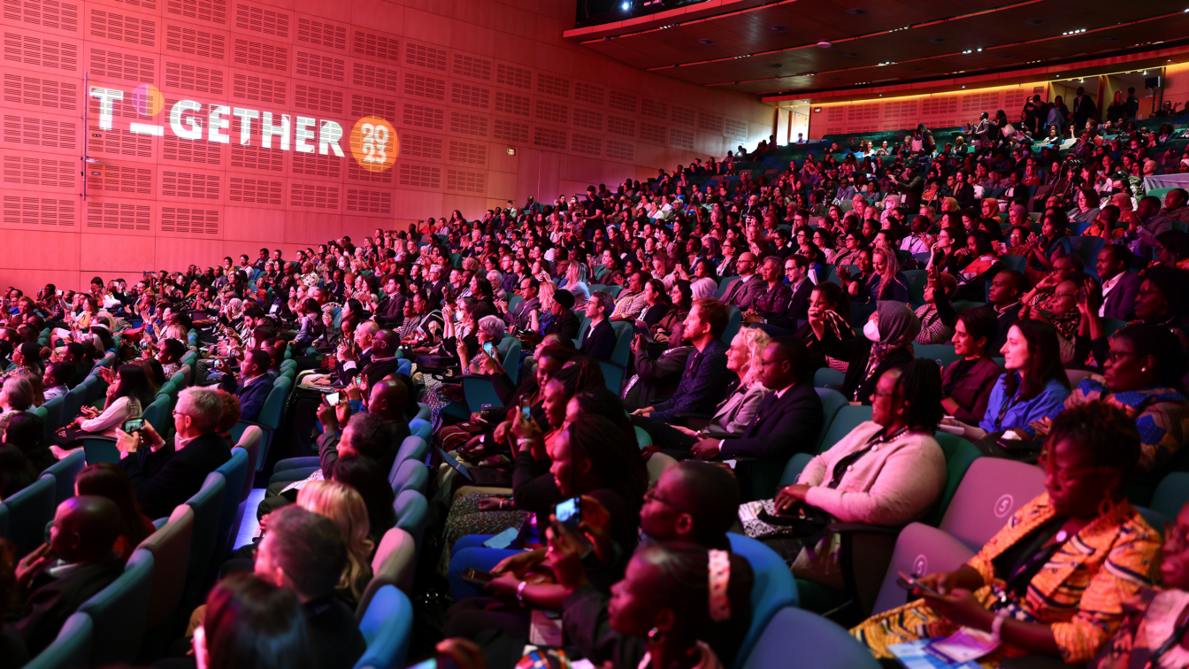 The opening plenary at the Conference attendees on the main floor at the International Maternal and Newborn Health Conference 2023